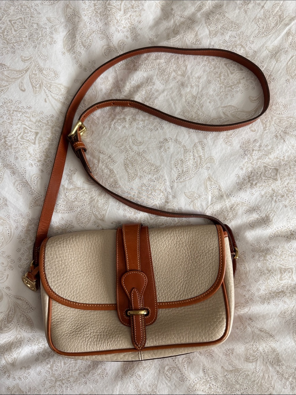 Dooney & Bourke Vintage Cream Pebbled Leather Crossbody with Tan Trim